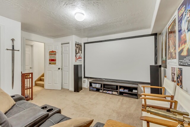 home theater with a textured ceiling and carpet
