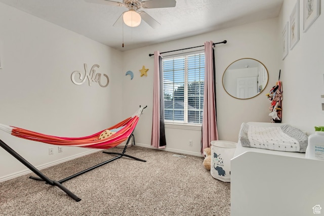 carpeted bedroom with baseboards and ceiling fan