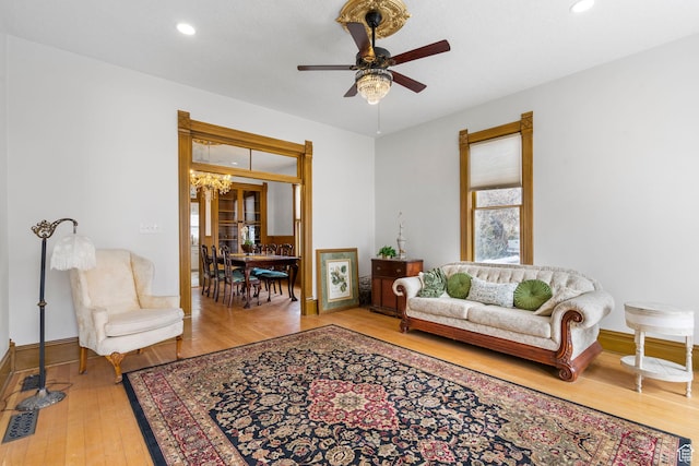 living room with recessed lighting, baseboards, a ceiling fan, and hardwood / wood-style flooring