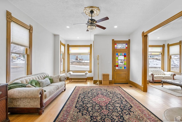 entrance foyer with plenty of natural light, recessed lighting, light wood finished floors, and a textured ceiling