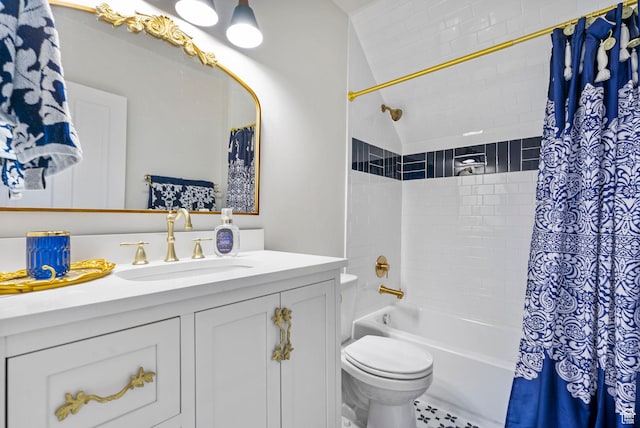 bathroom featuring vanity, shower / bath combination with curtain, and toilet