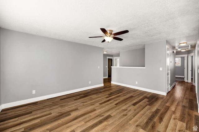 1170 N 730 E, Logan, UT 84341 - unfurnished living room with visible vents, baseboards, a textured ceiling, and wood finished floors