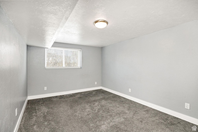 1170 N 730 E, Logan, UT 84341 - unfurnished room with carpet flooring, baseboards, and a textured ceiling