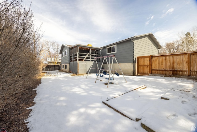 1170 N 730 E, Logan, UT 84341 - snow covered property with a playground and fence