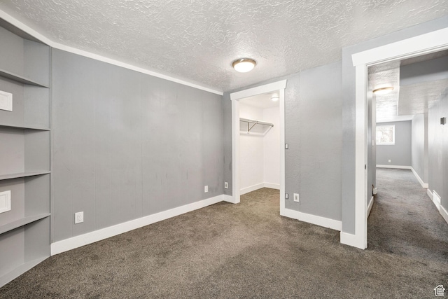 1170 N 730 E, Logan, UT 84341 - unfurnished bedroom with a spacious closet, carpet, baseboards, and a textured ceiling