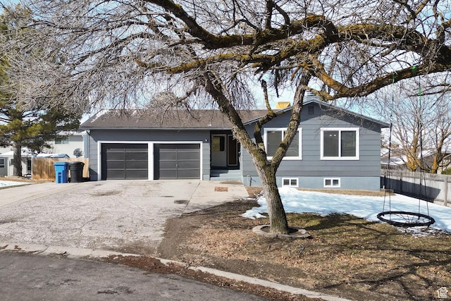 1170 N 730 E, Logan, UT 84341 - ranch-style home featuring a garage, concrete driveway, and fence