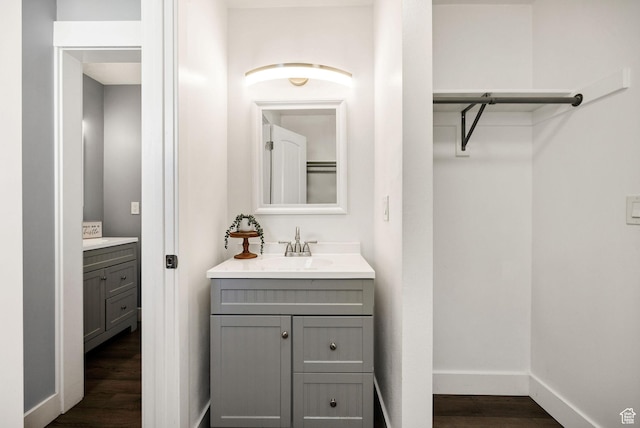 1170 N 730 E, Logan, UT 84341 - bathroom featuring vanity, baseboards, and wood finished floors