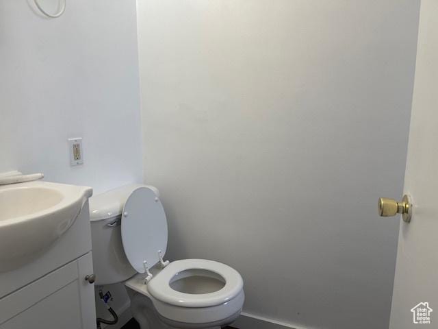 bathroom featuring vanity and toilet