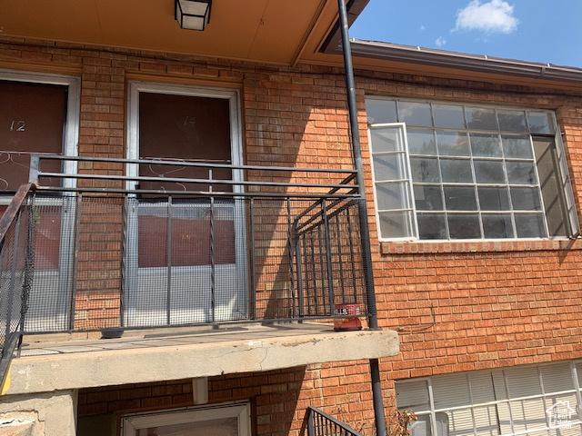 exterior space with brick siding
