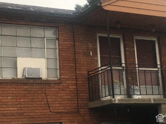 view of side of property featuring brick siding