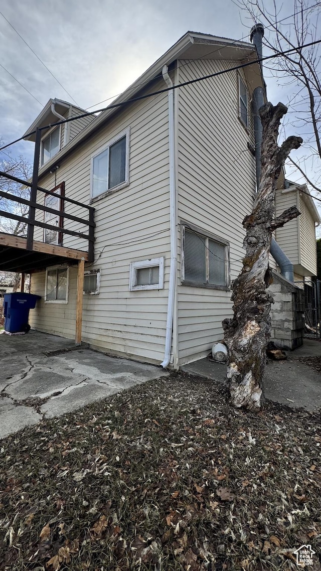 1010 Sullivan Rd, Ogden, UT 84403 - view of side of property with a wooden deck and a patio area