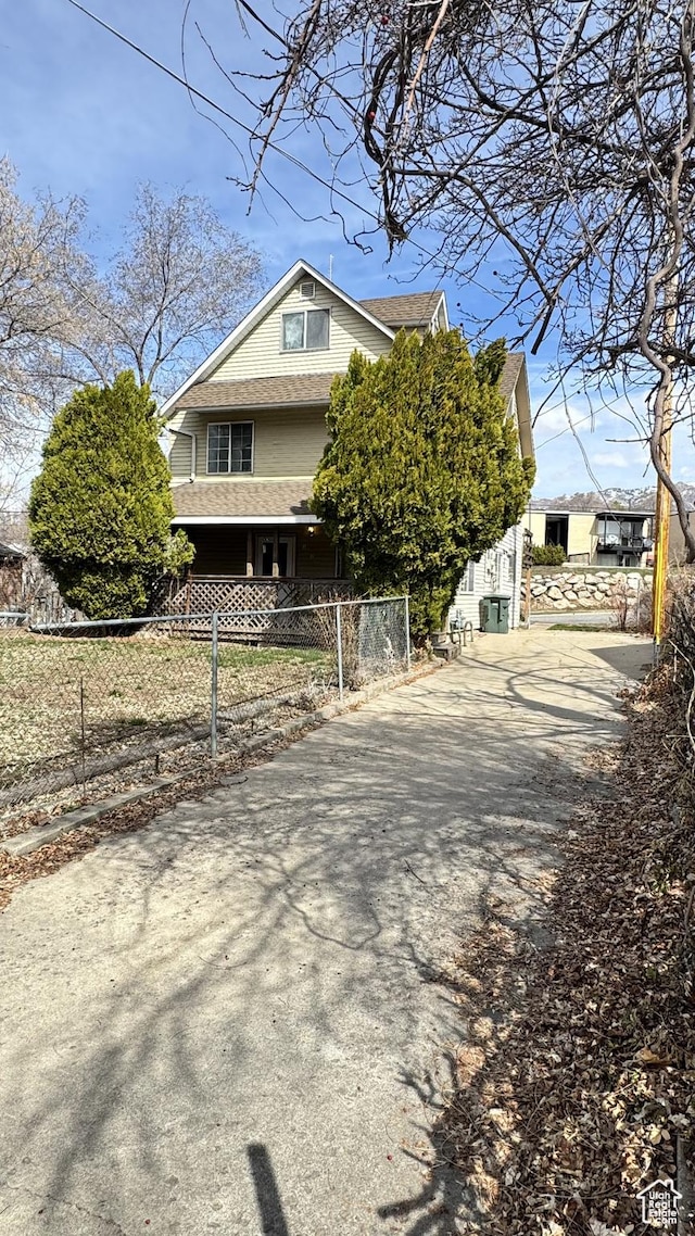 1010 Sullivan Rd, Ogden, UT 84403 - view of home's exterior featuring a fenced front yard and driveway