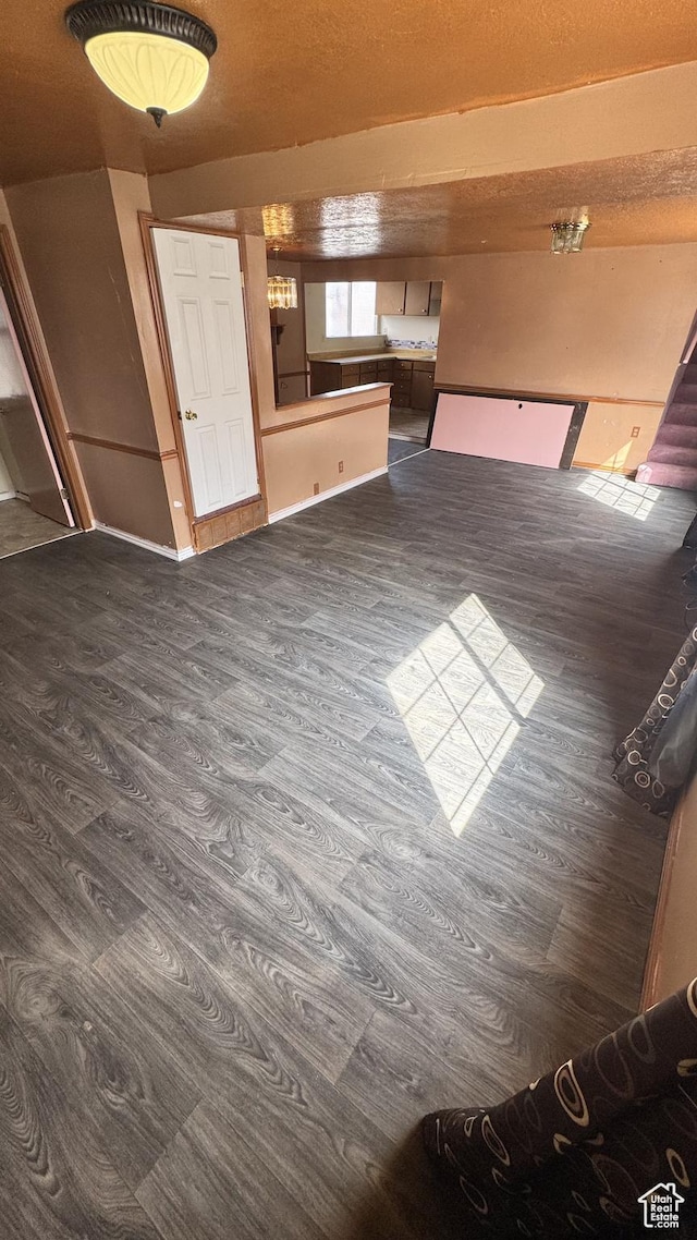 1010 Sullivan Rd, Ogden, UT 84403 - unfurnished living room featuring dark wood-style flooring