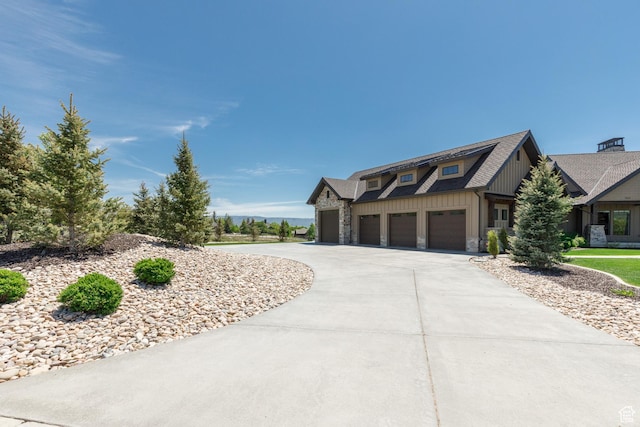 3651 N Eagle Ridge Dr E, Eden, UT 84310 - view of front of property featuring board and batten siding, driveway, and stone siding