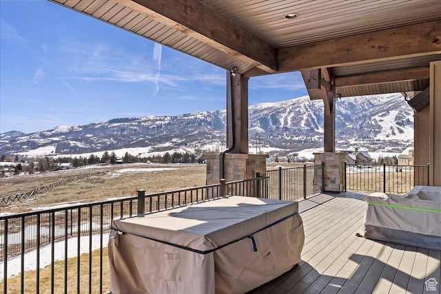 wooden terrace with a mountain view