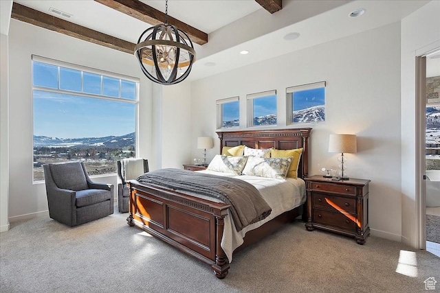 bedroom with visible vents, beam ceiling, baseboards, and light carpet
