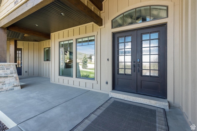 3651 N Eagle Ridge Dr E, Eden, UT 84310 - view of exterior entry featuring french doors and board and batten siding