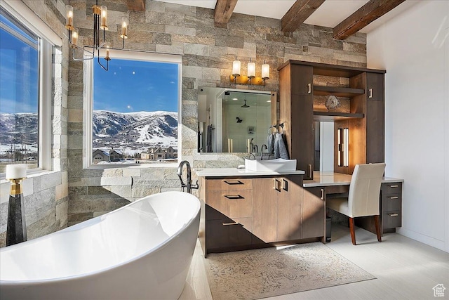 bathroom with a soaking tub, beam ceiling, vanity, and a shower stall