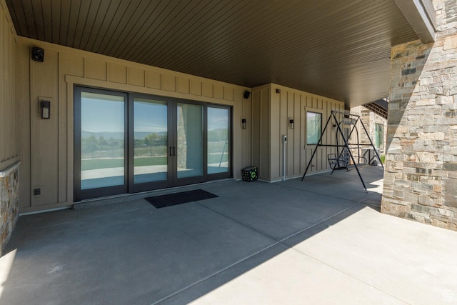 3651 N Eagle Ridge Dr E, Eden, UT 84310 - doorway to property with board and batten siding, a patio area, and french doors
