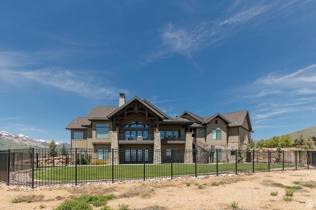 3651 N Eagle Ridge Dr E, Eden, UT 84310 - back of house with stone siding, a chimney, a mountain view, and board and batten siding