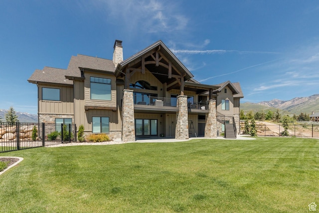 3651 N Eagle Ridge Dr E, Eden, UT 84310 - rear view of house featuring stone siding, a balcony, board and batten siding, a chimney, and a mountain view