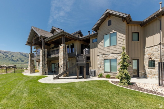 3651 N Eagle Ridge Dr E, Eden, UT 84310 - rear view of property with board and batten siding, stone siding, central air condition unit, a patio area, and stairs