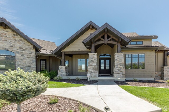 3651 N Eagle Ridge Dr E, Eden, UT 84310 - view of front of home with french doors, a standing seam roof, stone siding, and metal roof