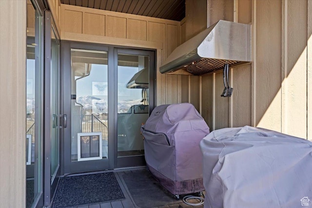 view of exterior entry with board and batten siding