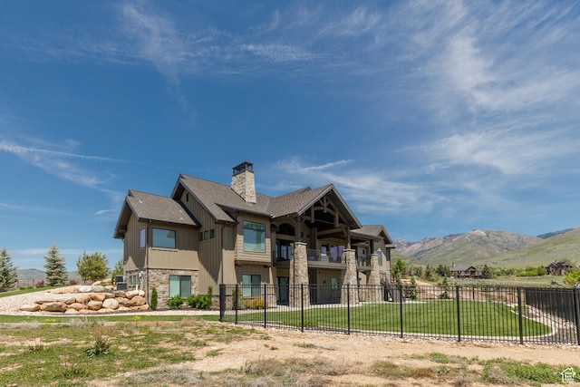 3651 N Eagle Ridge Dr E, Eden, UT 84310 - rear view of property featuring a balcony, a mountain view, a chimney, and stone siding
