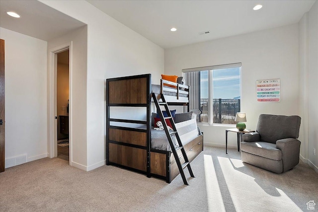 bedroom featuring light carpet, visible vents, recessed lighting, and baseboards