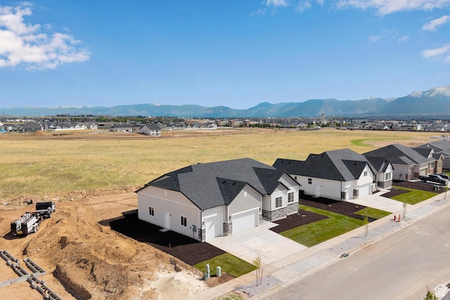 aerial view of residential area with a mountain backdrop