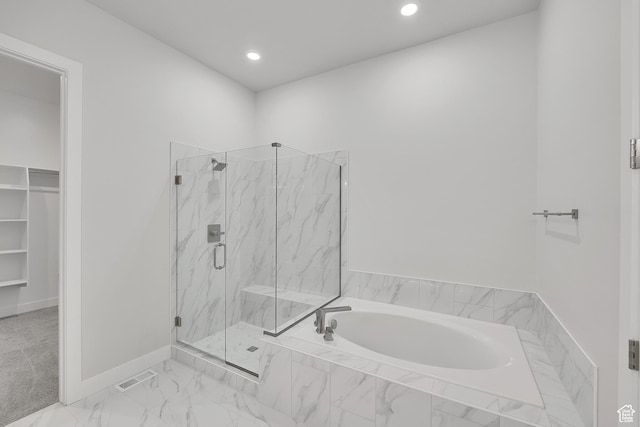 bathroom with a bath, a marble finish shower, recessed lighting, and a spacious closet