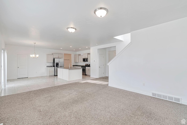 621 E Mayor Place Dr S, American Fork, UT 84003 - unfurnished living room with an inviting chandelier, light carpet, a sink, baseboards, and visible vents