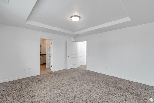 621 E Mayor Place Dr S, American Fork, UT 84003 - unfurnished bedroom featuring visible vents, a tray ceiling, baseboards, carpet, and ensuite bath