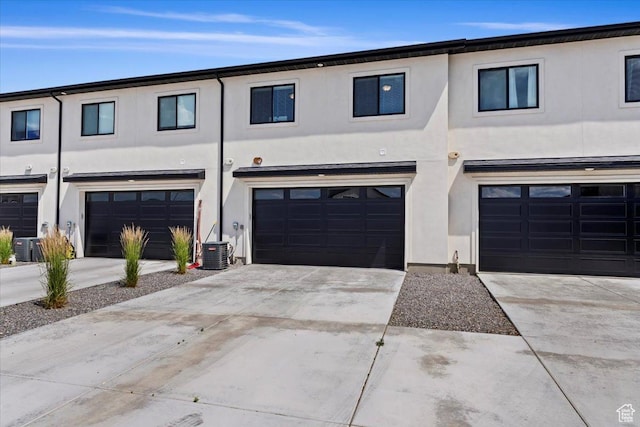 987 S 950 W, American Fork, UT 84003 - view of property featuring stucco siding, a garage, central AC, and concrete driveway