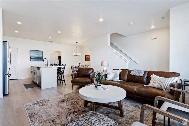 987 S 950 W, American Fork, UT 84003 - living room with recessed lighting, a notable chandelier, visible vents, and light wood-style floors