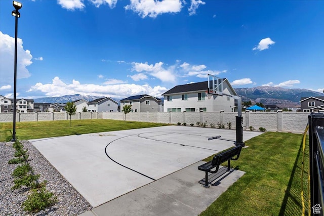987 S 950 W, American Fork, UT 84003 - view of basketball court with a fenced backyard, community basketball court, a mountain view, and a yard