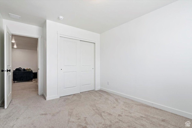 987 S 950 W, American Fork, UT 84003 - unfurnished bedroom featuring light colored carpet, baseboards, and a closet