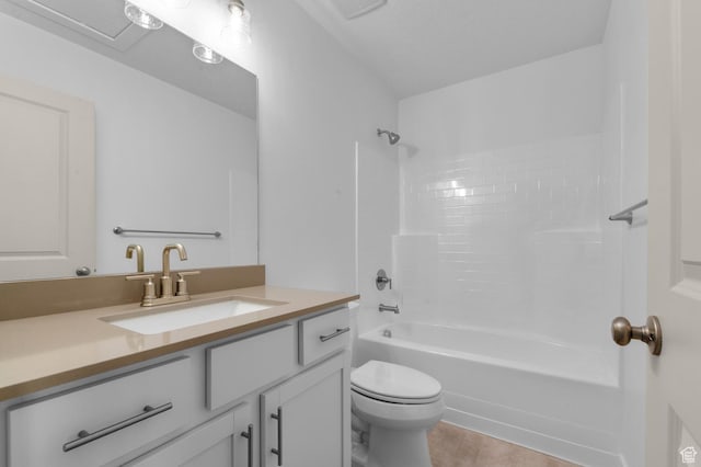 bathroom featuring visible vents, toilet, vanity, and shower / washtub combination