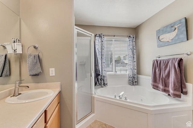 full bathroom with a bath, a stall shower, and vanity