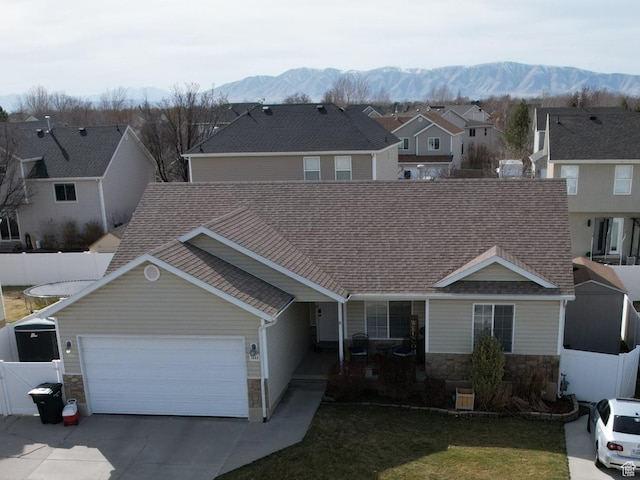 1444 S 2250 E, Spanish Fork, UT 84660 - traditional-style house featuring driveway, a garage, stone siding, a mountain view, and a residential view