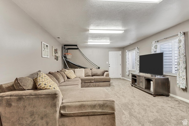 carpeted living room with visible vents, baseboards, and a textured ceiling