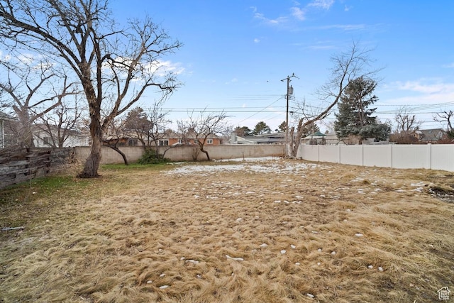 view of yard with a fenced backyard