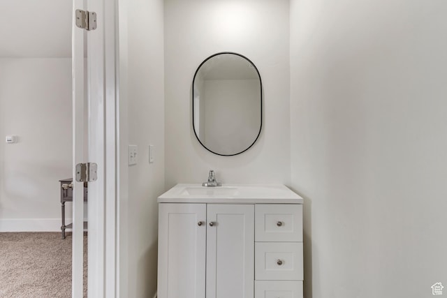 bathroom featuring baseboards and vanity