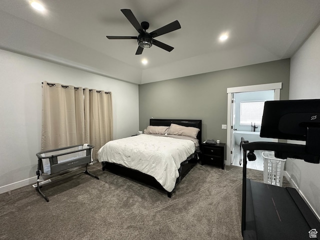 bedroom featuring carpet, a ceiling fan, and a tray ceiling