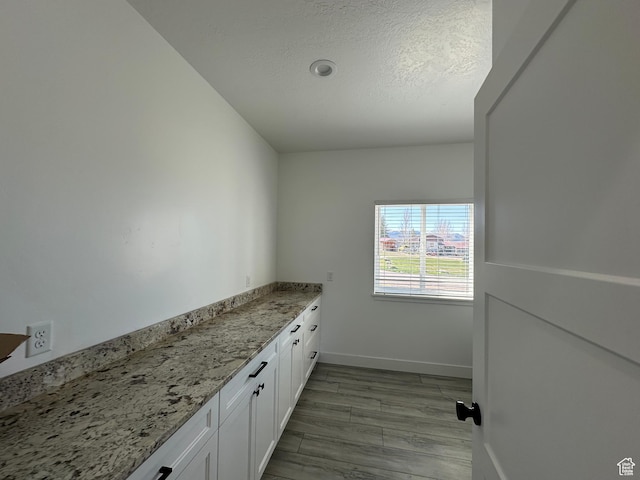 washroom featuring baseboards