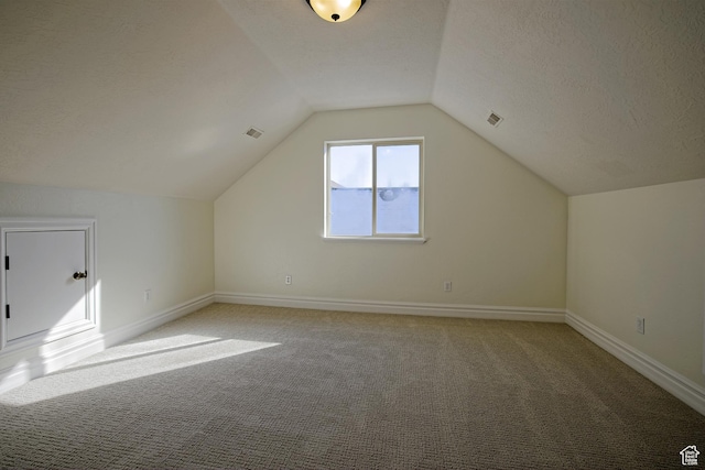 406 N 1420 E, Provo, UT 84606 - additional living space with light carpet, visible vents, a textured ceiling, and lofted ceiling