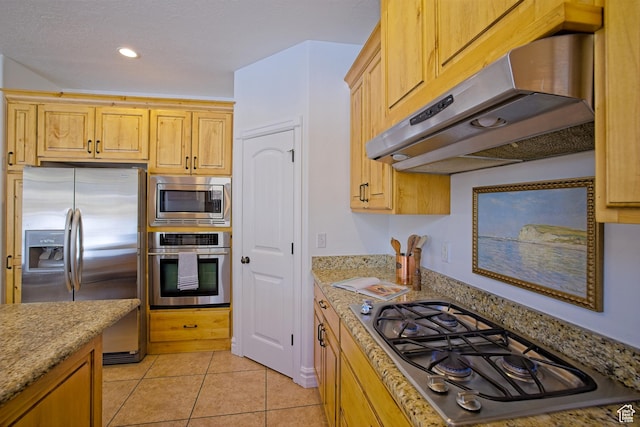 406 N 1420 E, Provo, UT 84606 - kitchen featuring light stone countertops, under cabinet range hood, light tile patterned floors, and appliances with stainless steel finishes
