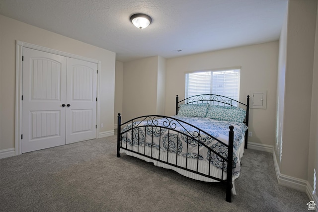 406 N 1420 E, Provo, UT 84606 - carpeted bedroom with a closet, baseboards, and a textured ceiling