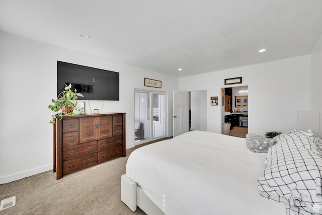 carpeted bedroom featuring recessed lighting, visible vents, and baseboards